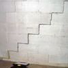 A diagonal stair step crack along the foundation wall of a Goffstown home