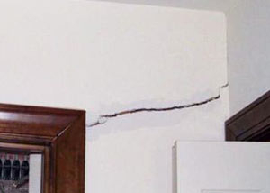 A large drywall crack in an interior wall in Hollis