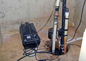 Pedestal sump pump system installed in a home in Londonderry