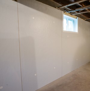 Basement wall covered with Foamax insulation panel